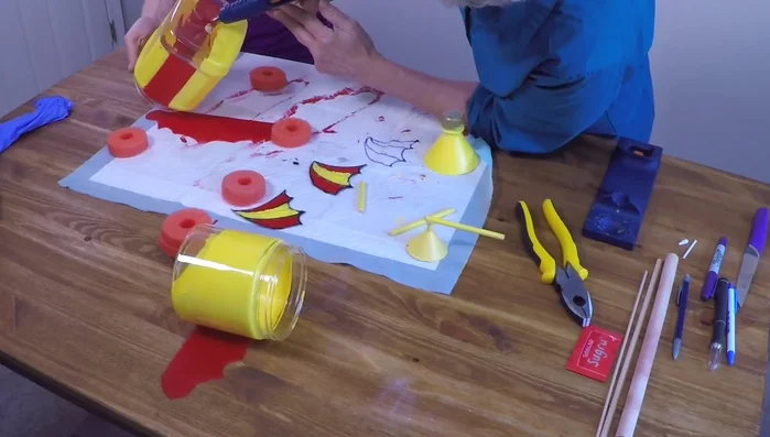 Attach the Mickey charm to the front of the sub.