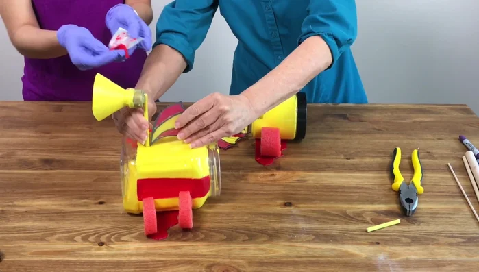 Use Sugru (moldable waterproof glue) to attach the remaining embellishments. Allow 24 hours to cure.