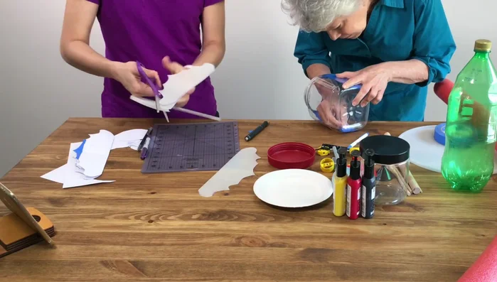 Paint the inside of the larger container and the cone. Note: Use waterproof paint if painting the exterior.