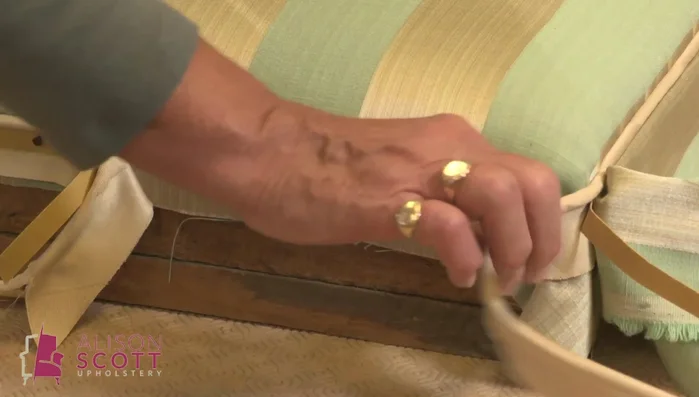 Secure the band around the bottom of the lid using tacks positioned far enough from the edge to be hidden by the lining.