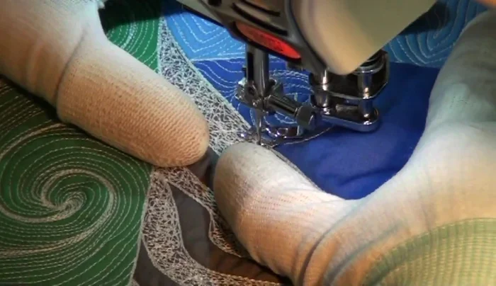 Fill in any remaining areas with gentle curving lines, repeating the echo quilting process multiple times to build up the shape.