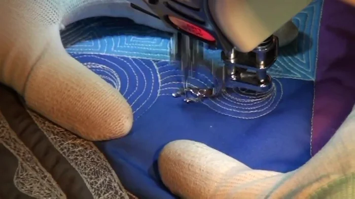 Address excess fabric by strategically placing lines to distribute the fullness. Rotate the quilt to maintain control and visibility.