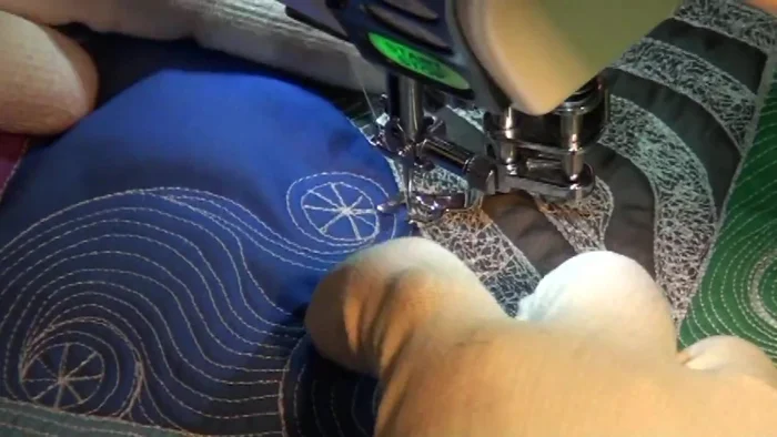 Address excess fabric by strategically placing lines to distribute the fullness. Rotate the quilt to maintain control and visibility.