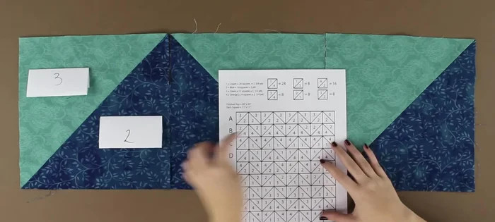Arrange the squares according to the pattern, ensuring proper alignment. Pin and stitch the rows together, pressing seams open.