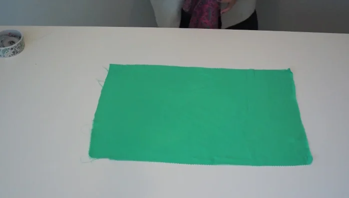 Create the facing: Cut a facing piece using a contrasting fabric or matching fabric (if available). A short facing is recommended to minimize fabric waste. Consider using interfacing for a crisper neckline.