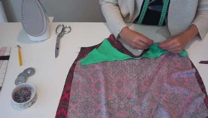 Sew the body: Pin the front and back pieces of the top together, right sides facing. Sew the side seams.