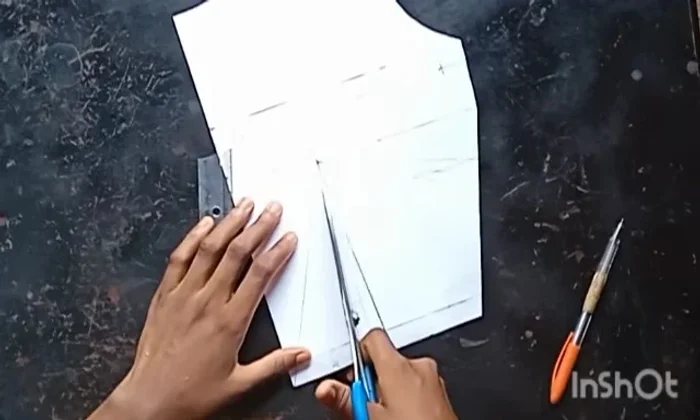 Cut along the style lines to slash and spread the pattern.