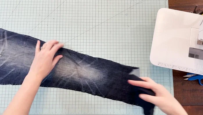 Cut denim squares: Fold the denim pieces in half and cut 5-inch strips. Cut these strips into 5-inch squares.