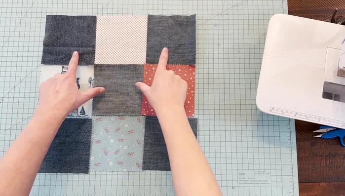 Create nine-patch blocks: Assemble nine-patch blocks using alternating denim and charm pack squares, aiming for 5 denim pieces in one block and 4 denim/5 cotton pieces in the next.