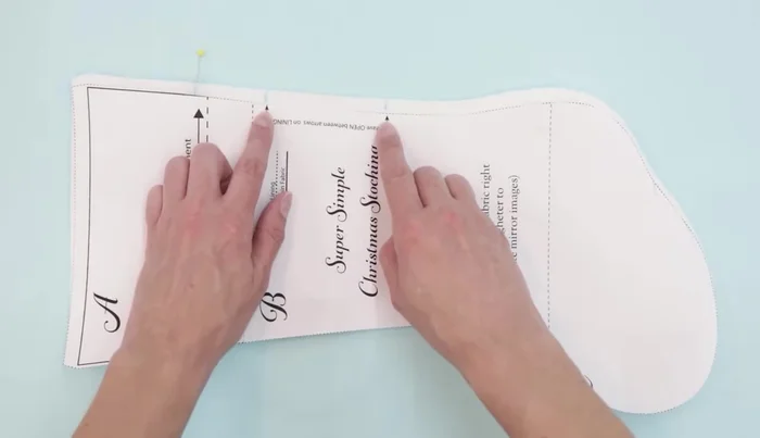 Sew the lining pieces together, leaving an opening for turning. Backstitch over the ribbon section to secure it.