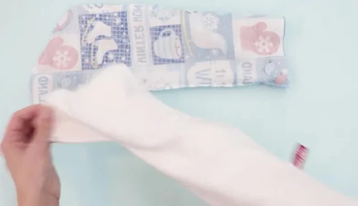 Place the lining (right side out) inside the main fabric (right sides together), aligning seams. Pin all around.