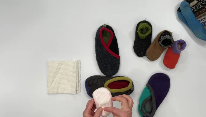 Sew the Jiffy Grip sole onto the slipper.