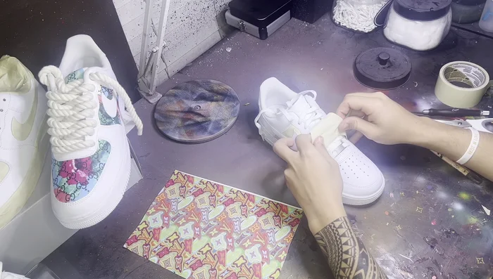 Peel and position the tape: Carefully peel the tape from one section and place the leather over the taped area, ensuring it is positioned correctly. Repeat for all sections.