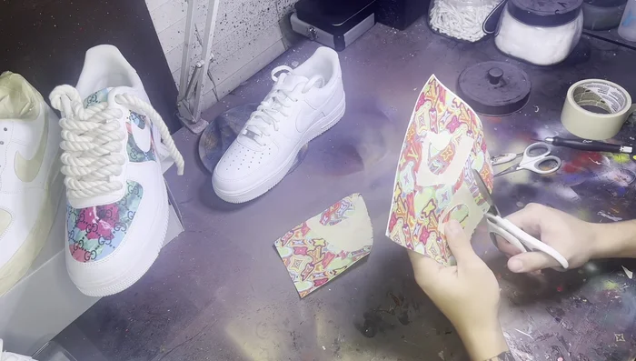 Trim the excess leather: Using fabric scissors, trim the excess leather as close to the tape as possible. The tape acts as a guideline; do not cut the tape itself.