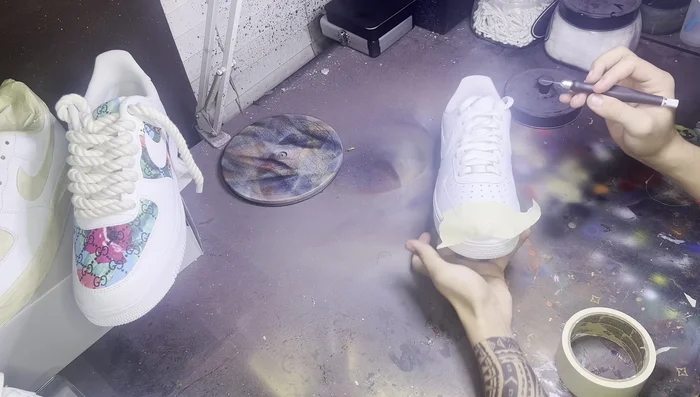 Cut the tape precisely: Use an X-Acto knife to cut along the edges of the panels, following the natural dips between the panels as a guide. Avoid cutting into the toe box or too far onto the adjacent panels.