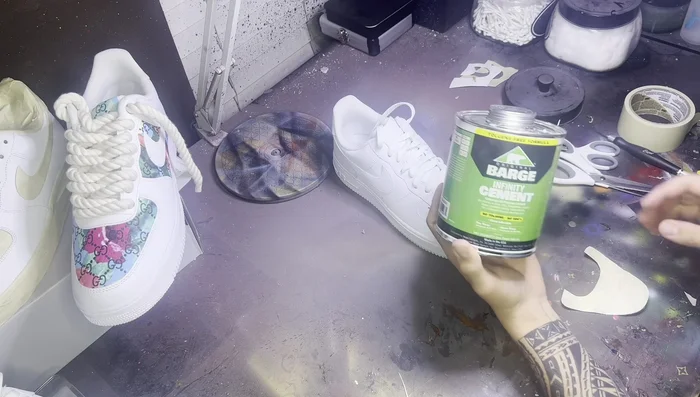 Attach the leather: Carefully place the glued leather onto the shoe, aligning it precisely. Use a Q-tip or paintbrush (discard afterwards) to smooth out any wrinkles or air bubbles.