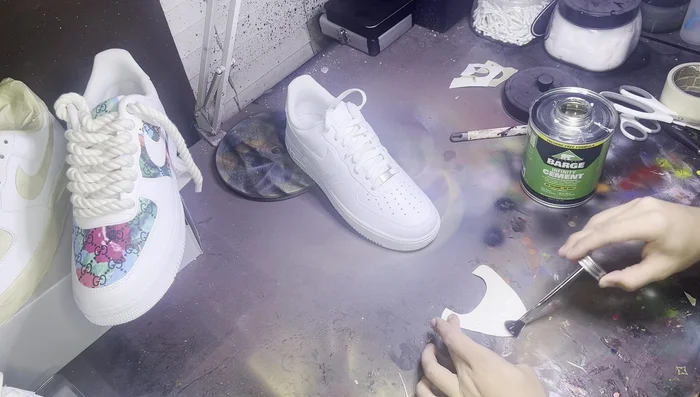 Attach the leather: Carefully place the glued leather onto the shoe, aligning it precisely. Use a Q-tip or paintbrush (discard afterwards) to smooth out any wrinkles or air bubbles.