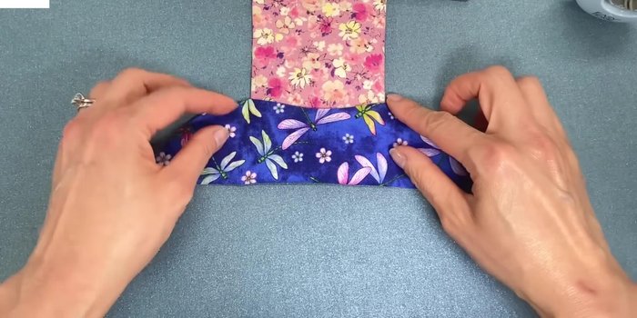 Fold and press: Fold and press the top edges to create a straight line. Repeat on the other side.