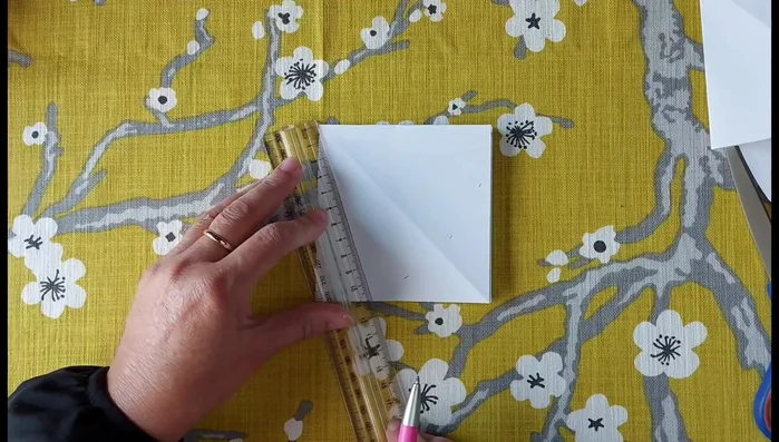 Create a smooth curve between your 75cm marks. Make several small marks in between to help guide your cutting line.