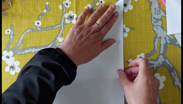 Cut off the excess length of fabric to create a 150cm x 150cm square.