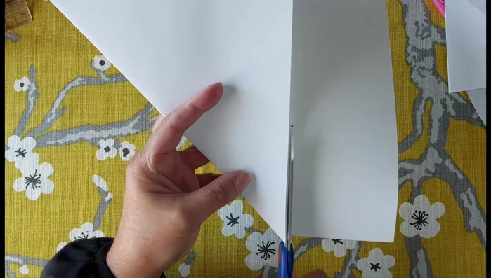 Cut off the excess length of fabric to create a 150cm x 150cm square.