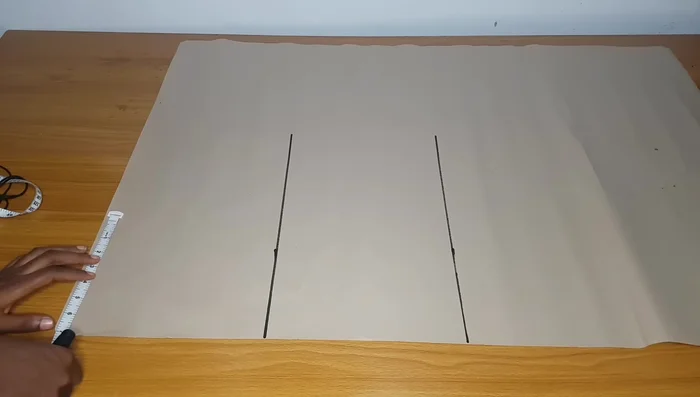 Draft the front pattern piece on pattern paper, including waistline, hipline, knee line, and full length. Add seam allowance.