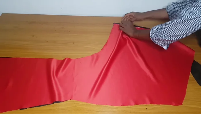Pin and pleat the slashed fabric to create the drape. Do not pin the lining to the main fabric; the lining is a guide.