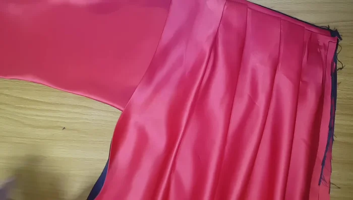 Finish the hem and any remaining details.