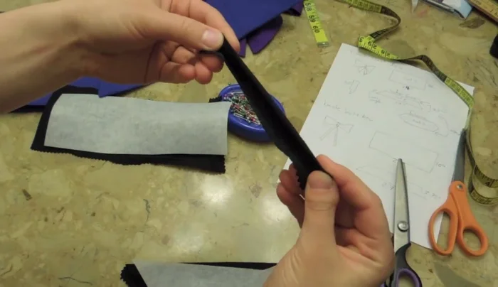 Cut a small, rectangular piece of fabric for the bow center. Fold this in half, then in half again.