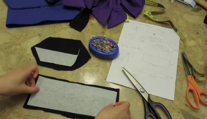 Turn the sewn pieces inside out to create tubes. This forms the main body of the bow.