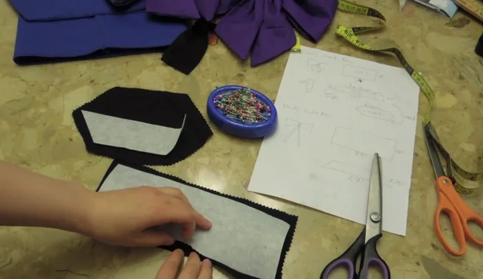 Turn the sewn pieces inside out to create tubes. This forms the main body of the bow.