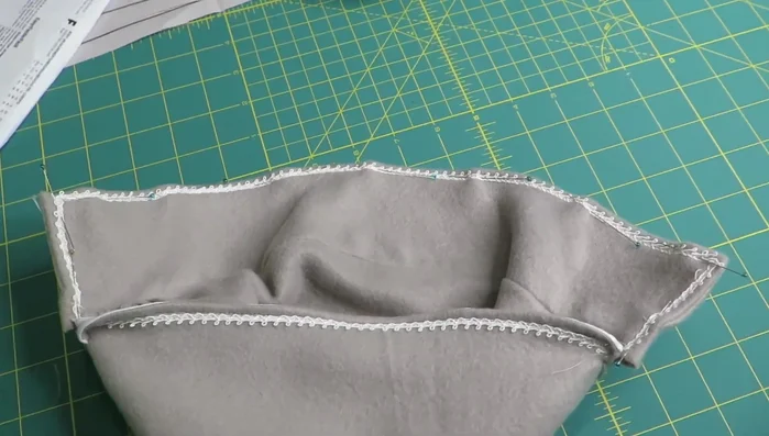 Attach trim to the front brim of the hat, stitching inside the brim to keep it hidden.