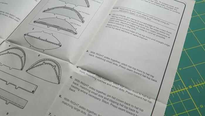 Stitch the hat top front to the hat top back, matching small dots. Press the seam toward the hat top back.