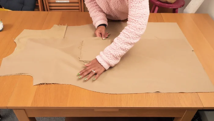 Stitch the shoulder and side seams of the main jacket, joining the front and back pieces.