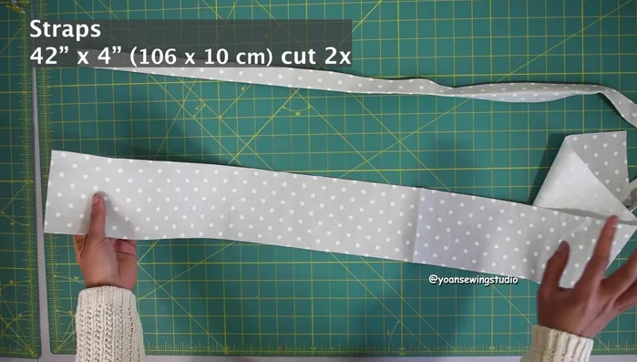 Prepare and attach the shoulder straps, adding adjuster sliders and swivel hooks.