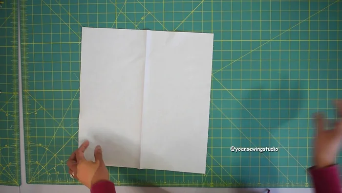 Prepare the interior lining panels, adding slip pockets and an interior zipper pocket.