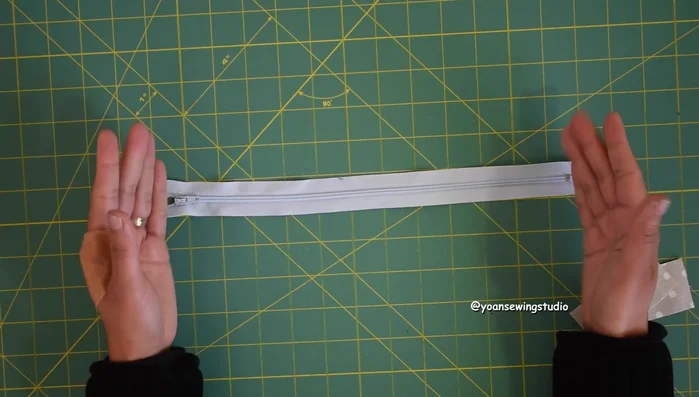 Prepare the zipper for the front pocket (13 inches long). Install zipper tabs.