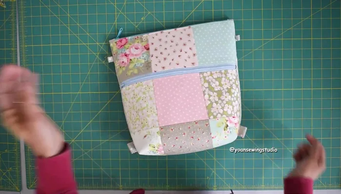 Finish the bag by closing the opening and attaching the straps.