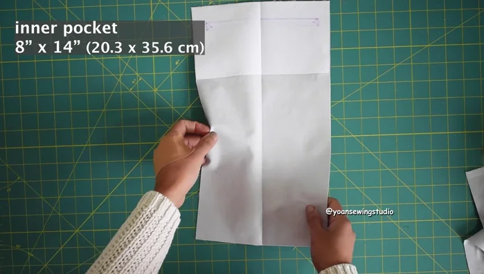 Create the inner zipper pocket for the back, following the template provided.