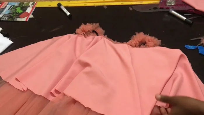 Attach sleeves to dress: Attach the gathered sleeves to the dress body, ensuring the raw edges are covered.