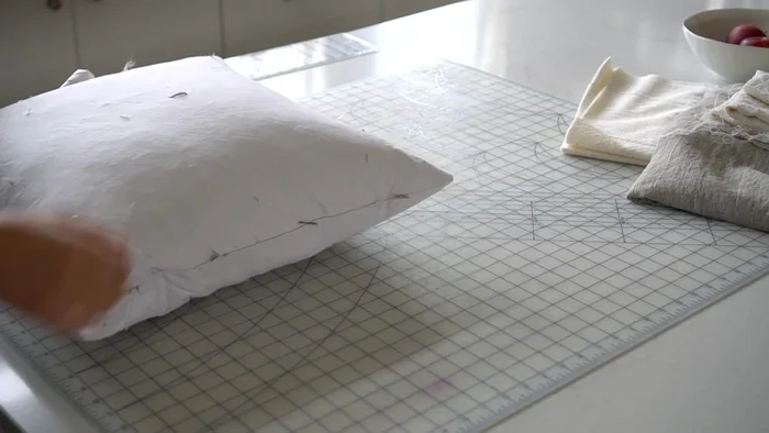 Cut two batting squares the same size as your fabric squares.