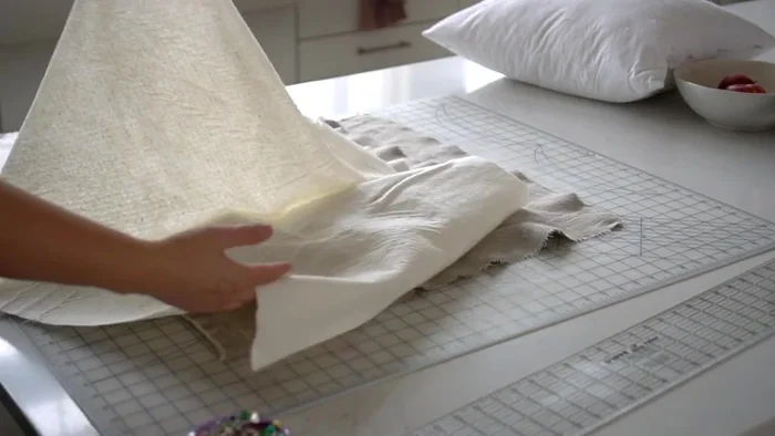 Cut two batting squares the same size as your fabric squares.
