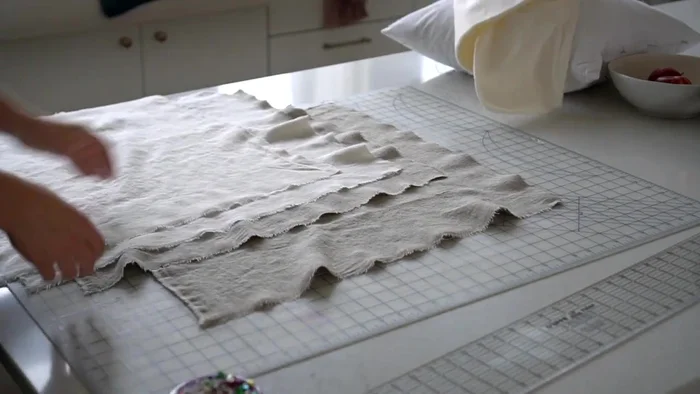 Cut two batting squares the same size as your fabric squares.