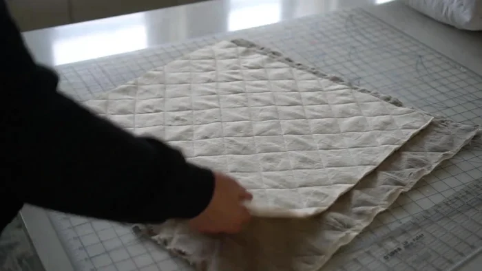 Trim the quilted pieces to 21x21 inches (or desired size).