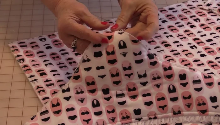 Fold and sew the top piece to the inside of the bag.