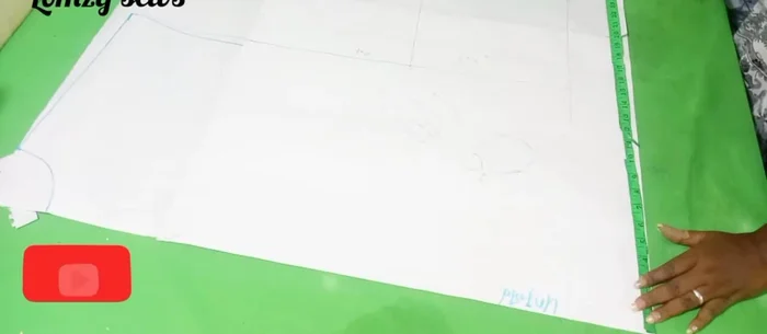 On your pattern paper (or directly on the fabric), draw a half-circle with the calculated radius and adjusted sleeve length.