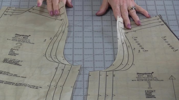 Prepare pattern pieces: Mark notches (single on front, double on back) and dots on both sleeve and garment.
