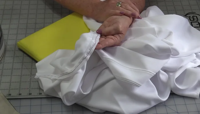 Finish edges: Finish the seam allowances of the garment according to your pattern instructions.