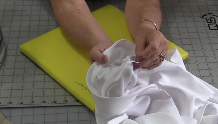 Finish edges: Finish the seam allowances of the garment according to your pattern instructions.