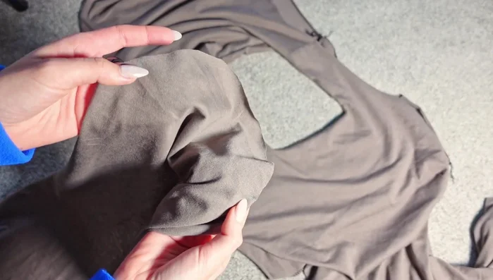 Attach the sleeves to the dress, aligning pattern notches. Pin generously to ease the fabric around curves.